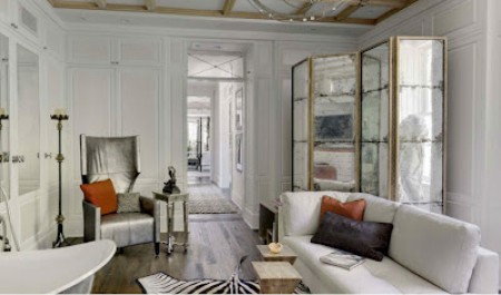 white sofa zebra carpet vintage mirrored room divider